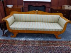 A BIEDERMEIER STYLE SATIN WOOD SETTEE, THE SHOW FRAME BACK SCROLLING TO A CENTRAL FAN, ROSETTES