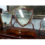 A 19th C. SHIELD SHAPED DRESSING TABLE MIRROR SUPPORTED ON SERPENTINE FRONTED BOX WITH THREE