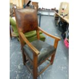 A LEATHER UPHOLSTERED WALNUT ELBOW CHAIR, THE SQUARE LEGS JOINED BY STRETCHERS.