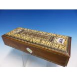 AN INDIAN SANDALWOOD BOX, THE RECTANGULAR TOP IVORY MOUNTED WITH A BEZIQUE MARKER WITHIN AN INLAID