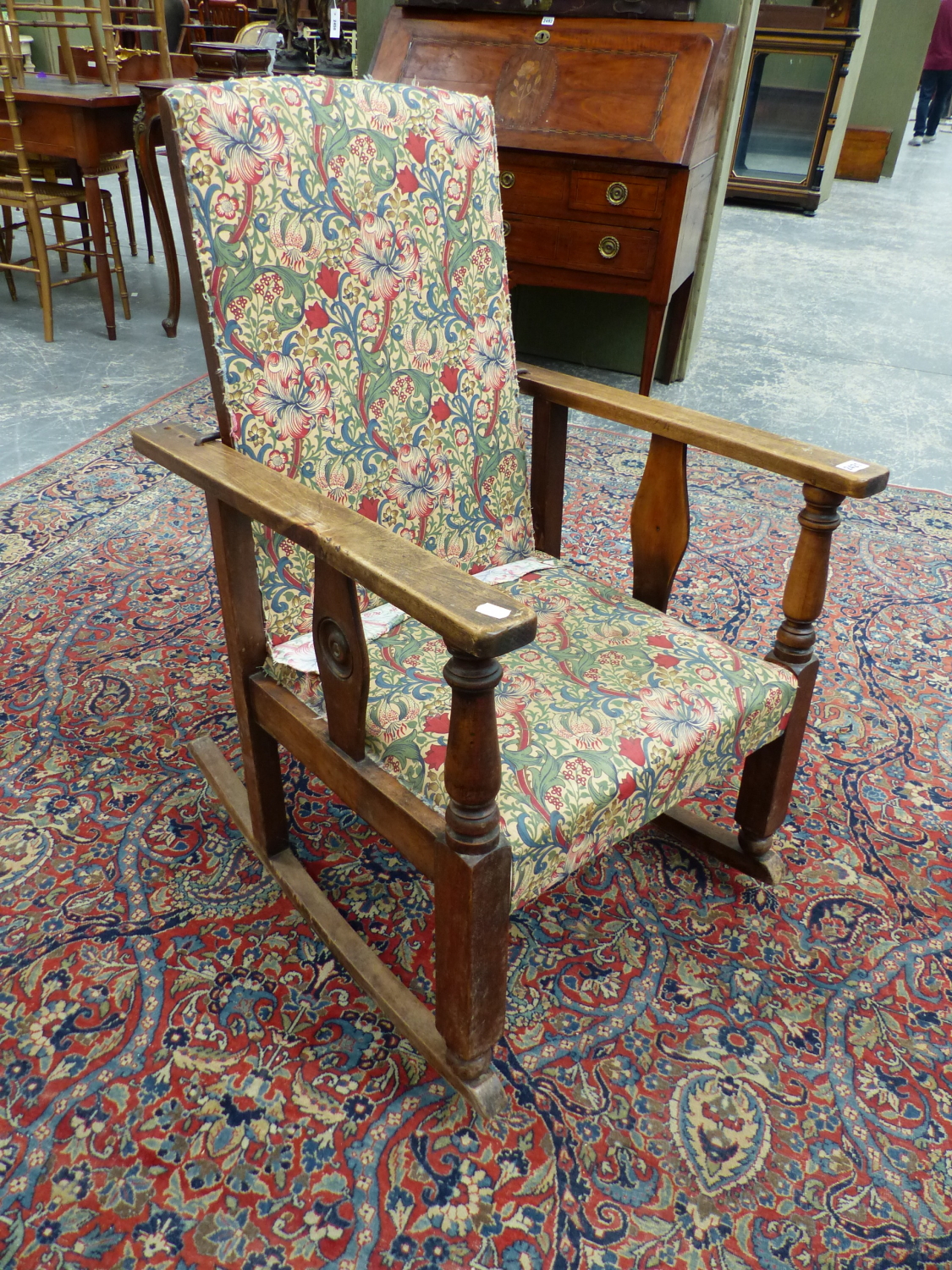 A MORRIS TYPE RECLINING BACK ROCKING ARMCHAIR.