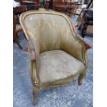 A GILT LOUIS XV STYLE SHOW FRAME FAUTEUIL, THE ROUNDED BACK TOPPED BY THREE SCROLLS, THE CABRIOLE