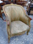 A GILT LOUIS XV STYLE SHOW FRAME FAUTEUIL, THE ROUNDED BACK TOPPED BY THREE SCROLLS, THE CABRIOLE