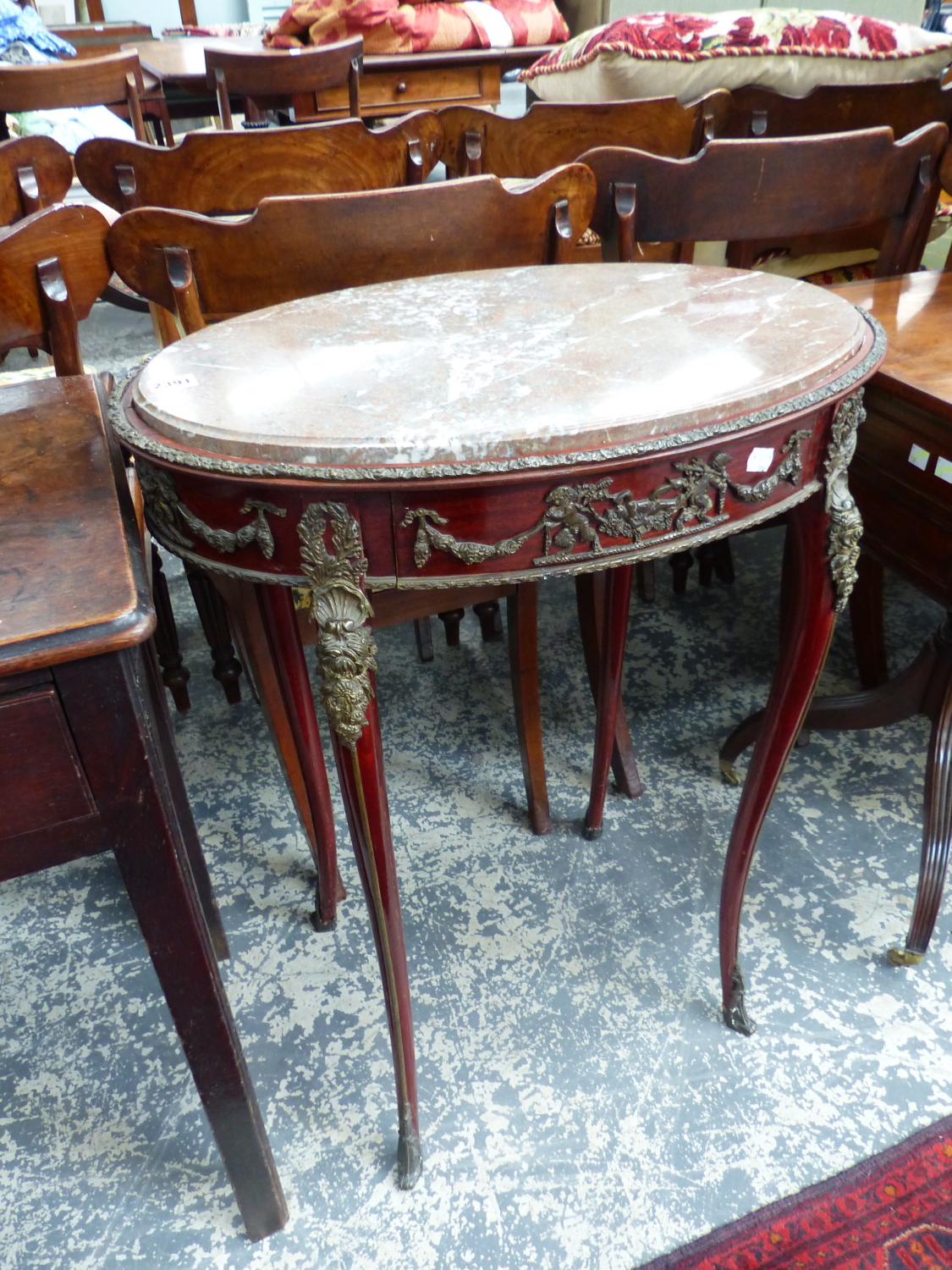 A FRENCH OVAL MARBLE TOP TABLE WITH ORMOLU MOUNTS AND FITTED DRAWER. 58 x 38cms.