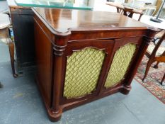 A VICTORIAN MAHOGANY TWO DOOR CABINET, COLUMN PILASTERS FLANK GRILLED DOORS. SHAPED PLINTH BASE.