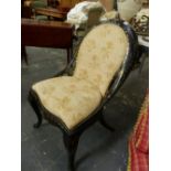 A VICTORIAN PAPIER MACHE INLAID WITH MOTHER OF PEARL NURSING CHAIR, THE UPHOLSTERED HOOP BACK