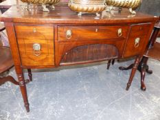 A 19th C. MAHOGANY BOW FRONT SIDEBOARD, THE CENTRAL DRAWER OVER A TAMBOUR AND FLANKED BY A