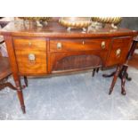 A 19th C. MAHOGANY BOW FRONT SIDEBOARD, THE CENTRAL DRAWER OVER A TAMBOUR AND FLANKED BY A