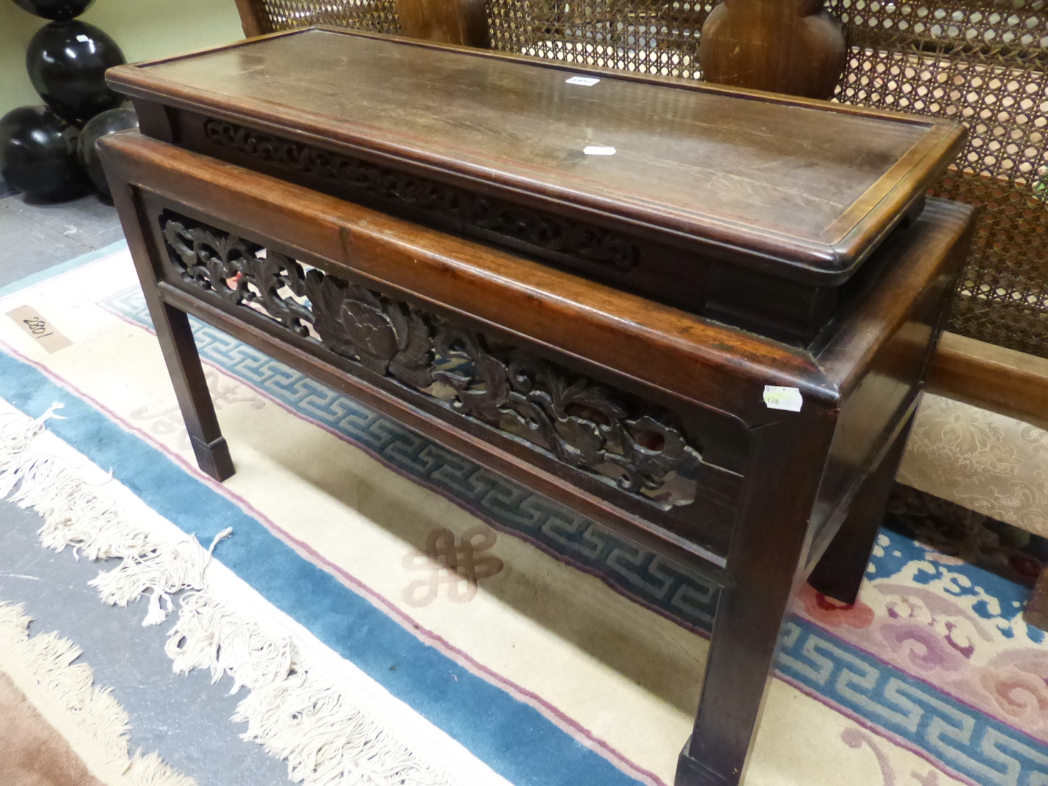 A CHINESE HARDWOOD COFFEE TABLE, THE RECTANGULAR TOP RECESSED ABOVE THE APRON PIERCED AND CARVED