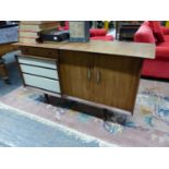 A BEAUTILITY RETRO SIDEBOARD WITH UNUSUAL DRAWER AND CUPBOARD ARRANGEMENT. H. 82 x W. 144 x D.