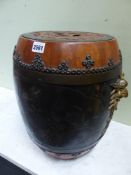 A PAIR OF BLACK LACQUERED ORIENTAL WOOD BARREL SHAPED JARS, THE RED GROUND COVERS WITH CASH