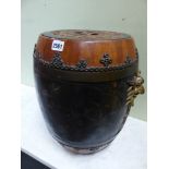 A PAIR OF BLACK LACQUERED ORIENTAL WOOD BARREL SHAPED JARS, THE RED GROUND COVERS WITH CASH