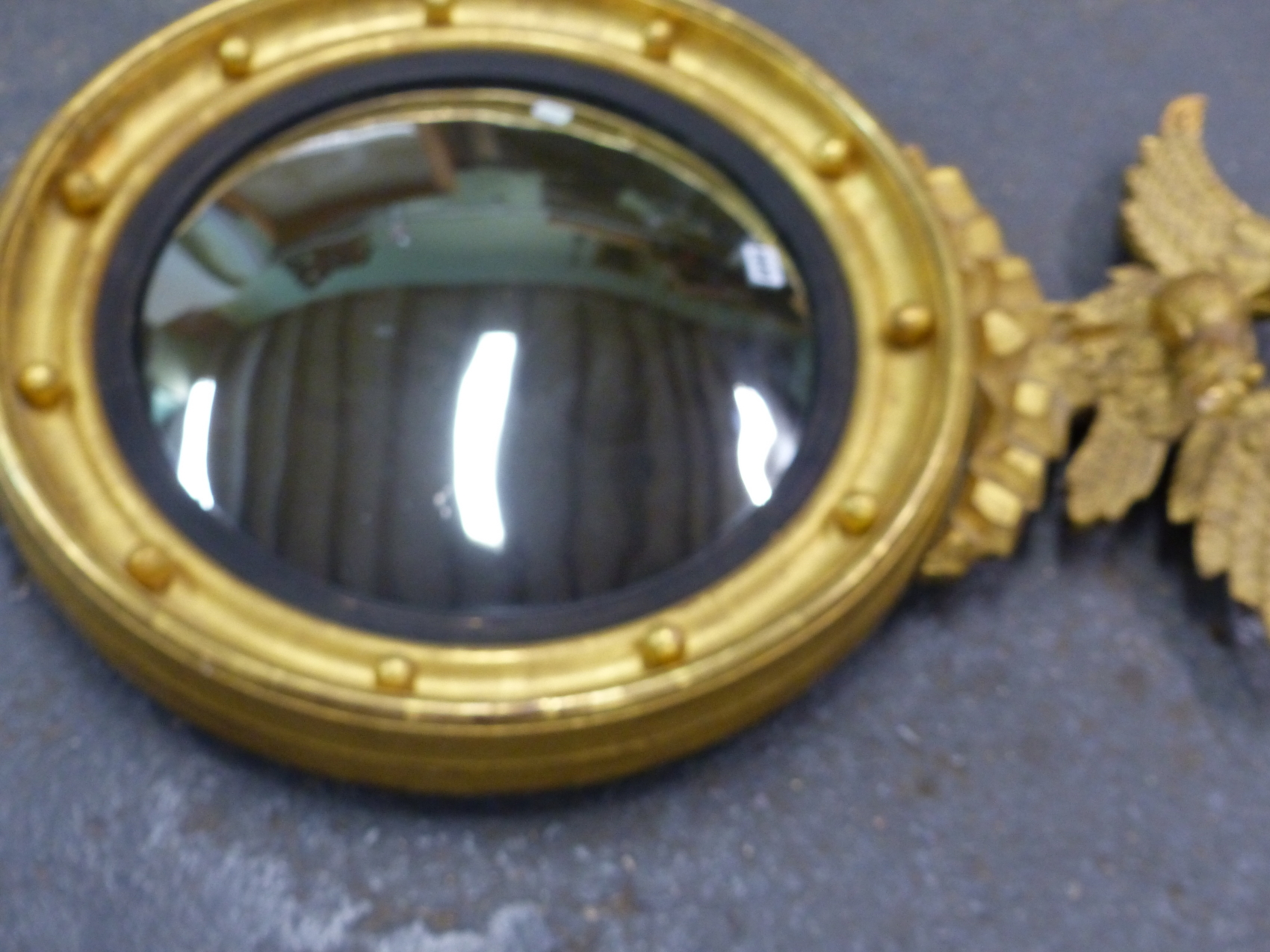 A CONVEX MIRROR WITHIN REEDED SLIP AND BEADED GILT FRAME SURMOUNTED BY AN EAGLE. H 90 x Dia. 63cms. - Image 9 of 13