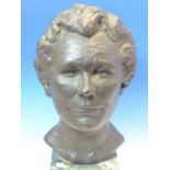 LOUISA BOLT, 1975, A BRONZE HEAD OF A LADY ON A VARIEGATED GREEN MARBLE PLINTH. H 45cms.