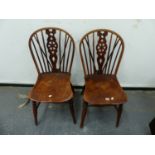 A PAIR OF ANTIQUE WHEELBACK WINDSOR CHAIRS.