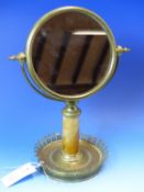 A FRENCH GILT METAL CIRCULAR SHAVING MIRROR, THE ROPE BORDERED FRAME ON OCHRE MARBLE GUN BARREL COLU