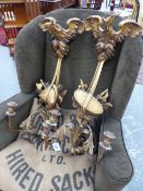 A PAIR OF GILTWOOD TWO LIGHT WALL BRACKETS TOPPED BY SPREAD EAGLES, A DRUM BELOW ONE AND A HELMET