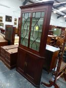 A GEORGIAN MAHOGANY TWO PART CORNER CUPBOARD, TWO DOOR GLAZED UPPER SECTION ENCLOSING SHAPED