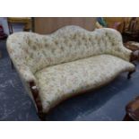 A VICTORIAN WALNUT SHOW FRAME AND BUTTON UPHOLSTERED LARGE SALON SETTEE. W.190cms.