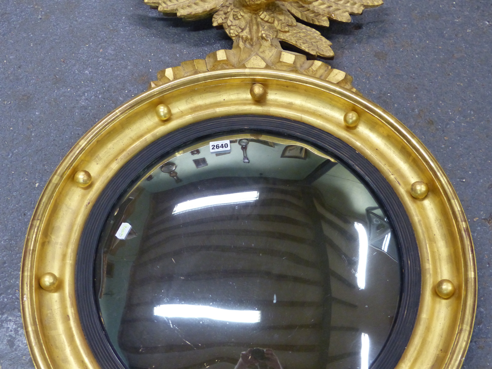 A CONVEX MIRROR WITHIN REEDED SLIP AND BEADED GILT FRAME SURMOUNTED BY AN EAGLE. H 90 x Dia. 63cms. - Image 7 of 13