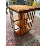 AN EDWARDIAN STYLE MAHOGANY AND INLAID SMALL REVOLVING BOOKCASE. 48 x 48 x H.79cms.