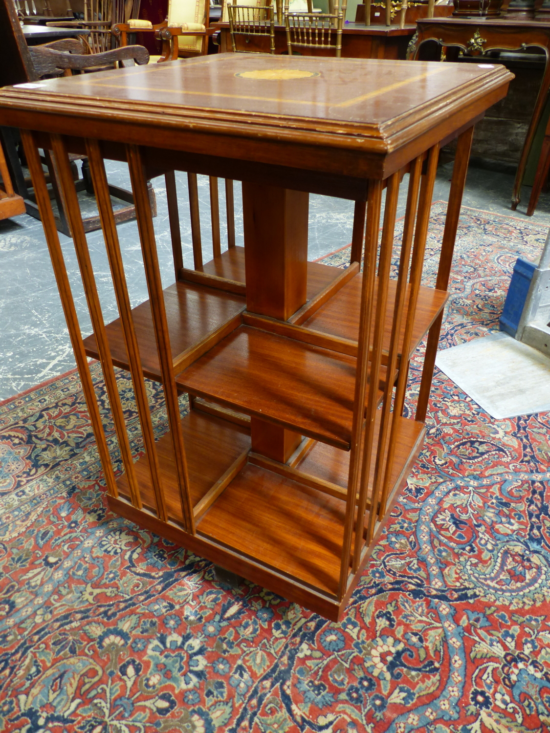 AN EDWARDIAN STYLE MAHOGANY AND INLAID SMALL REVOLVING BOOKCASE. 48 x 48 x H.79cms. - Image 2 of 4