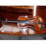 A PARIS MADE VIOLIN BEARING AN INDISTINCT MAKERS MARK AT THE TOP OF THE BACK AND IN A LEATHERETTE