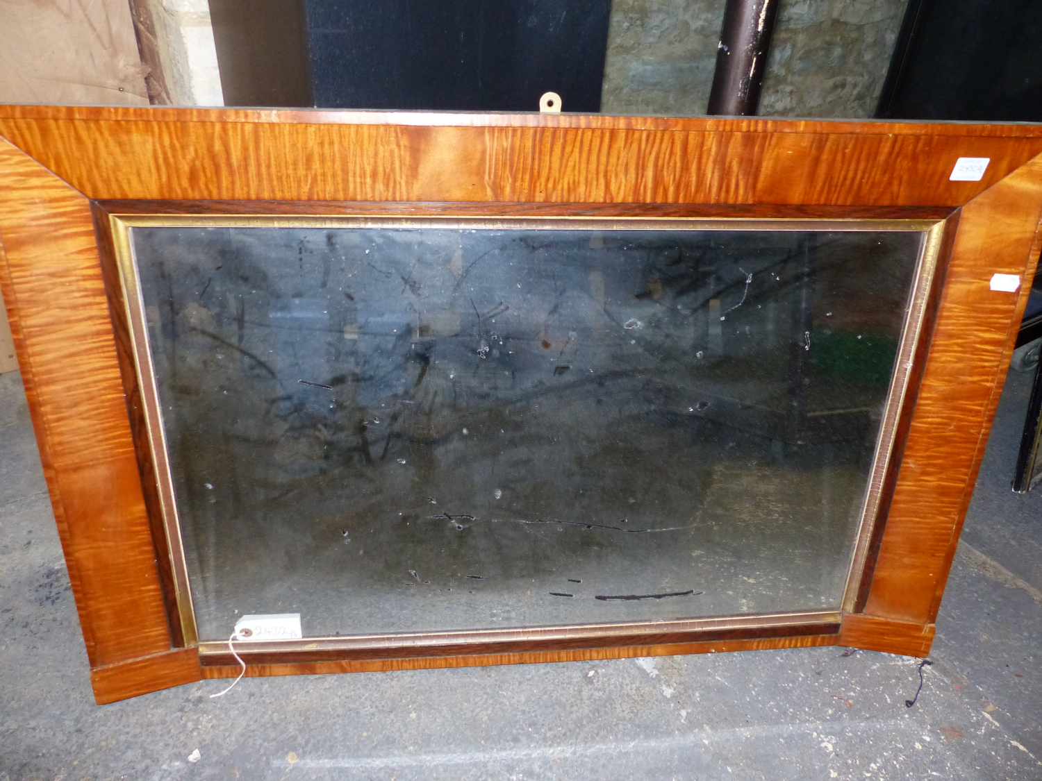 AN ANTIQUE MAPLE OVERMANTLE MIRROR. 62 x 96cms.