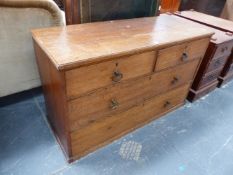 AN ANTIQUE OAK FOUR DRAWER LOW CHEST. H. 74 x W. 124 x D. 47cms.