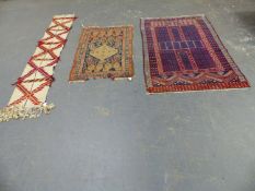 AN ANTIQUE PERSIAN TRIBAL RUG 133 x 90cms. TOGETHER WITH AN ORIENTAL RUG OF TURKOMAN DESIGN AND A
