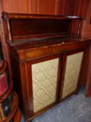 A REGENCY ROSEWOOD SIDE CABINET, THE RECTANGULAR TOP WITH REAR RECESSED SHELF, THE DAMASK INSET