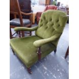 A VICTORIAN BUTTON BACK NURSING CHAIR ON TURNED FORELEGS.