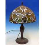 A TIFFANY STYLE TABLE LAMP WITH METAL BASE AND LEADED GLASS SHADE. H 47cms.