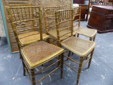 A SET OF 19th.C.FAUX BAMBOO GILT DECORATED SIDE CHAIRS WITH CANE SEATS.