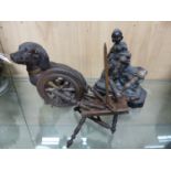 A PAINTED POTTERY MODEL OF A SEATED DACHSHUND. H 19cms. A WOODEN MODEL OF A SPINNING MACHINE