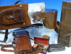 A COCKTAIL SHAKER, SANDWICH BOX, NEST OF DRINKING CUPS AND HAIR BRUSHES IN LEATHER TRAVELLING