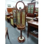 A STYLISH VICTORIAN MAHOGANY AND BRASS ADJUSTABLE SHAVING STAND. CIRCULAR MIRROR ABOVE CANDLE