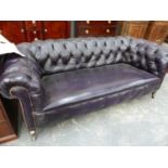 A VICTORIAN BUTTON UPHOLSTERED LEATHER CHESTERFIELD SETTEE ON TURNED FORELEGS. W.200 x D.90 x H.