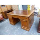 A LARGE VICTORIAN OAK TWIN PEDESTAL PARTNER'S DESK WITH ARRANGEMENT OF THREE FRIEZE DRAWERS OVER