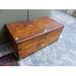 A CAMPHOR WOOD CAMPAIGN TRUNK, THE CORNERS BOUND BY BRASS STRAPS, BRASS HANDLES AT EACH END. W 90