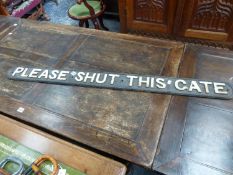 AN IRON SIGN WITH THE RELIEF LETTERING COLOURED WHITE AND READING PLEASE SHUT THIS GATE. W 127cms.