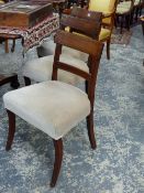 A SET OF SIX GEO.III.MAHOGANY AND BRASS STRUNG DINING CHAIRS WITH SABRE FORELEGS. (6)