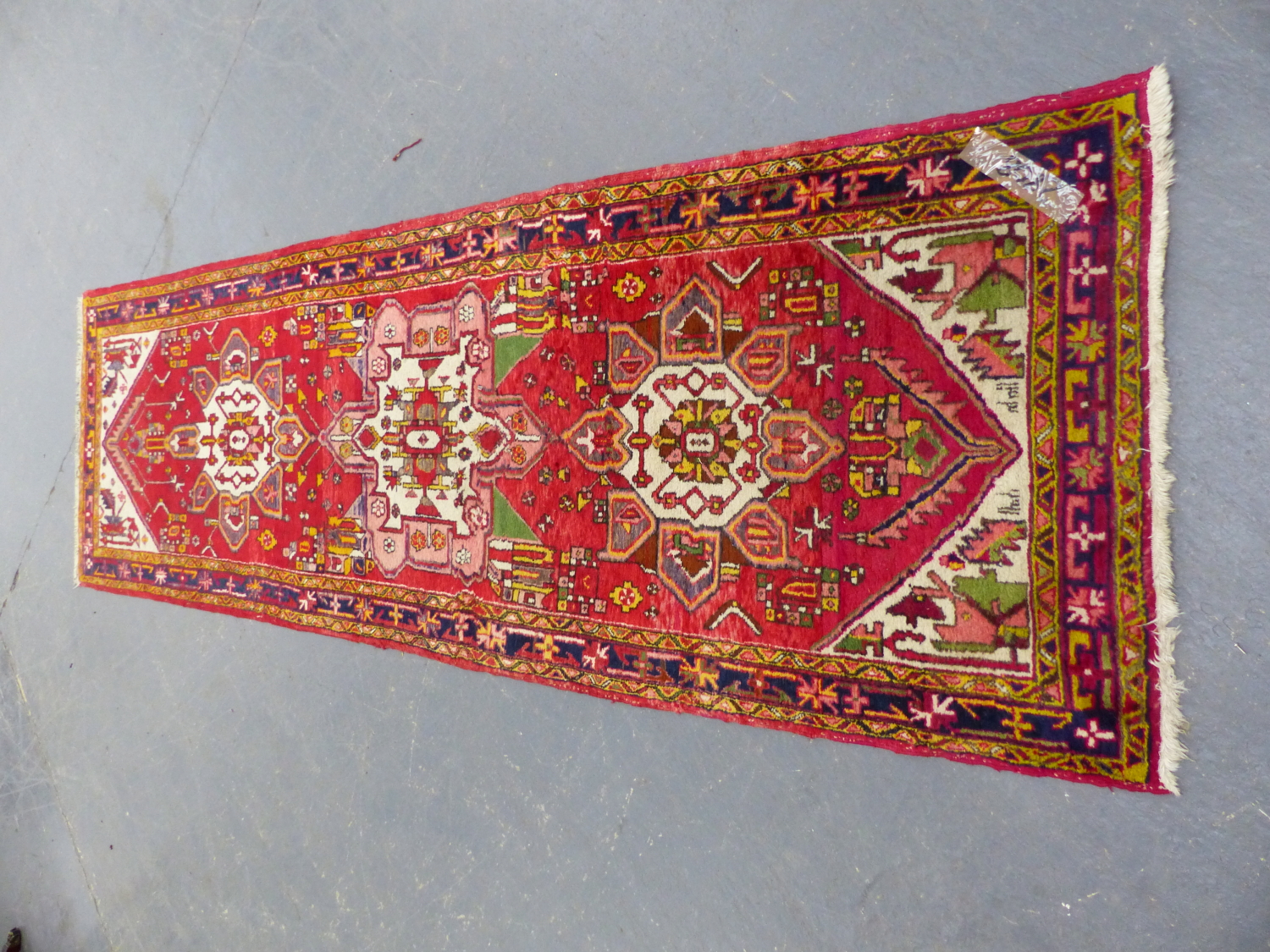 A PERSIAN TRIBAL RUNNER. 312 x 96cms.