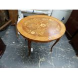 A FLORAL MARQUETRY OVAL COFFEE TABLE ON CABRIOLE LEGS WITH FOLIATE ORMOLU MOUNTED FEET. W 71 x D