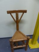 A PINE TURNER'S CHAIR, THE BOWED TOP RAIL ON TURNED COLUMN ABOVE THE TRIANGULAR SEAT.