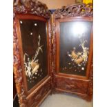 A LARGE LATE VICTORIAN ORIENTAL CARVED TWO FOLD SCREEN WITH IVORY AND LACQUER PANELS. EACH PANEL,
