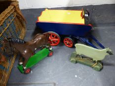 A VINTAGE PAINTED WOOD TOY HAY CART, A MODEL HORSE ON WHEELS AND A SIMILAR MODEL SHEEP.