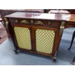 A ROSEWOOD REGENCY AND LATER EGYPTIAN REVIVAL ORMOLU MOUNTED SIDE CABINET, SHALLOW DROP FRONT DRAWER