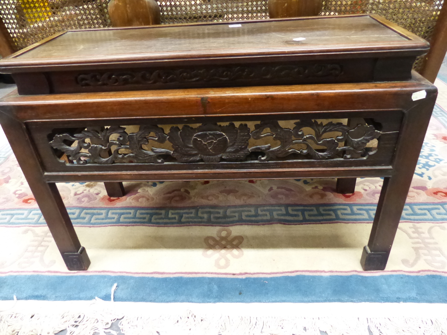 A CHINESE HARDWOOD COFFEE TABLE, THE RECTANGULAR TOP RECESSED ABOVE THE APRON PIERCED AND CARVED - Image 2 of 4