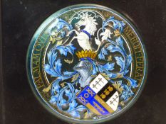 H E SIMPSON, LEEDS, HIS 1912 ENAMEL ROUNDEL FOR THE ACHIEVEMENT OF ARMS OF S D KITSON ESQ. WITHIN